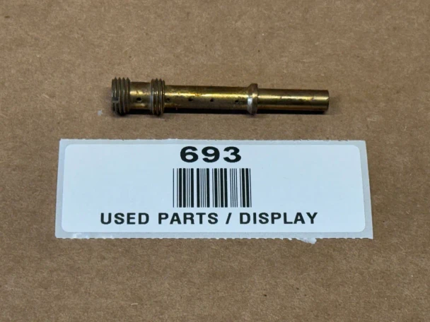 A brass nozzle part for Allis Chalmers farm tractors, specifically models WD45 and D17, displayed on a cardboard background with a white label reading "693 USED PARTS / DISPLAY."