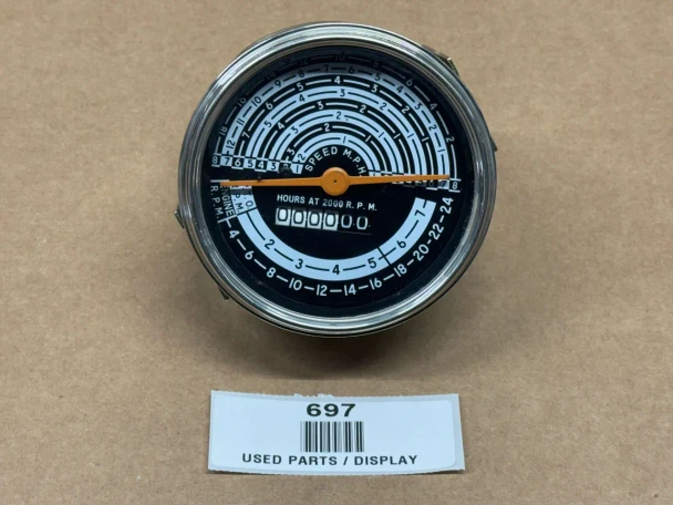 A tachometer display for Allis-Chalmers farm tractors, specifically models D15, I60, I600, with part number 70236777/236777. The face of the tachometer shows speed in miles per hour up to 7, and additional markings for other measurements, with a digital display showing hours at 2000 RPM.
