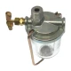 Close-up of a metal Allis-Chalmers tractor sediment bowl assembly with a clear glass bowl, retaining wire, brass shutoff valve and wing handle, and a threaded top inlet; the body is marked “OUT.”