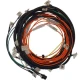 A wiring harness kit with multiple wires in black, orange, yellow, and green, each with labels or connectors, designed for Allis-Chalmers D19 Gas LP tractor.