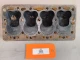 Allis-Chalmers Used Allis-Chalmers G Cylinder Head - 429, vintage engine part with four cylinders and visible rust and wear.