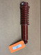 Allis Chalmers WD CA Seat Shock Absorber with Spring, red suspension shock with coil spring and mounting components for tractor seat, displayed on a brown background.