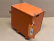 Allis Chalmers G Battery Box, display of an orange metal battery box with lifting lugs on top and a white tag attached to the side.