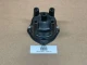 Distributor Cap ACR1954, a black automotive distributor cap with six ports for spark plug wires, displayed on a brown background with a label indicating it's a used part.