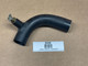 Allis-Chalmers Lower Water Pipe Tube AC-192D, used black water pipe with a brass fitting, displayed on a brown surface with a label marked '508' and 'USED PARTS / DISPLAY'.