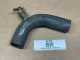 Allis-Chalmers Lower Water Pipe for D10 D12 D14 D15, used water pipe with a bend and threaded connection, displayed on a beige background.