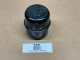 Oil Fill Breather Cap Without Clip, display image of a black oil fill breather cap without clip on a beige surface.