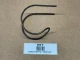Allis-Chalmers Snap Coupler Bell Hook Spring 70226514, used part displayed on a brown surface with a label below indicating it's for display.