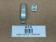 Delco Distributor Cap Spring Clip AB-488SD, display of a metal spring clip and its mounting plate on a brown surface with a label.