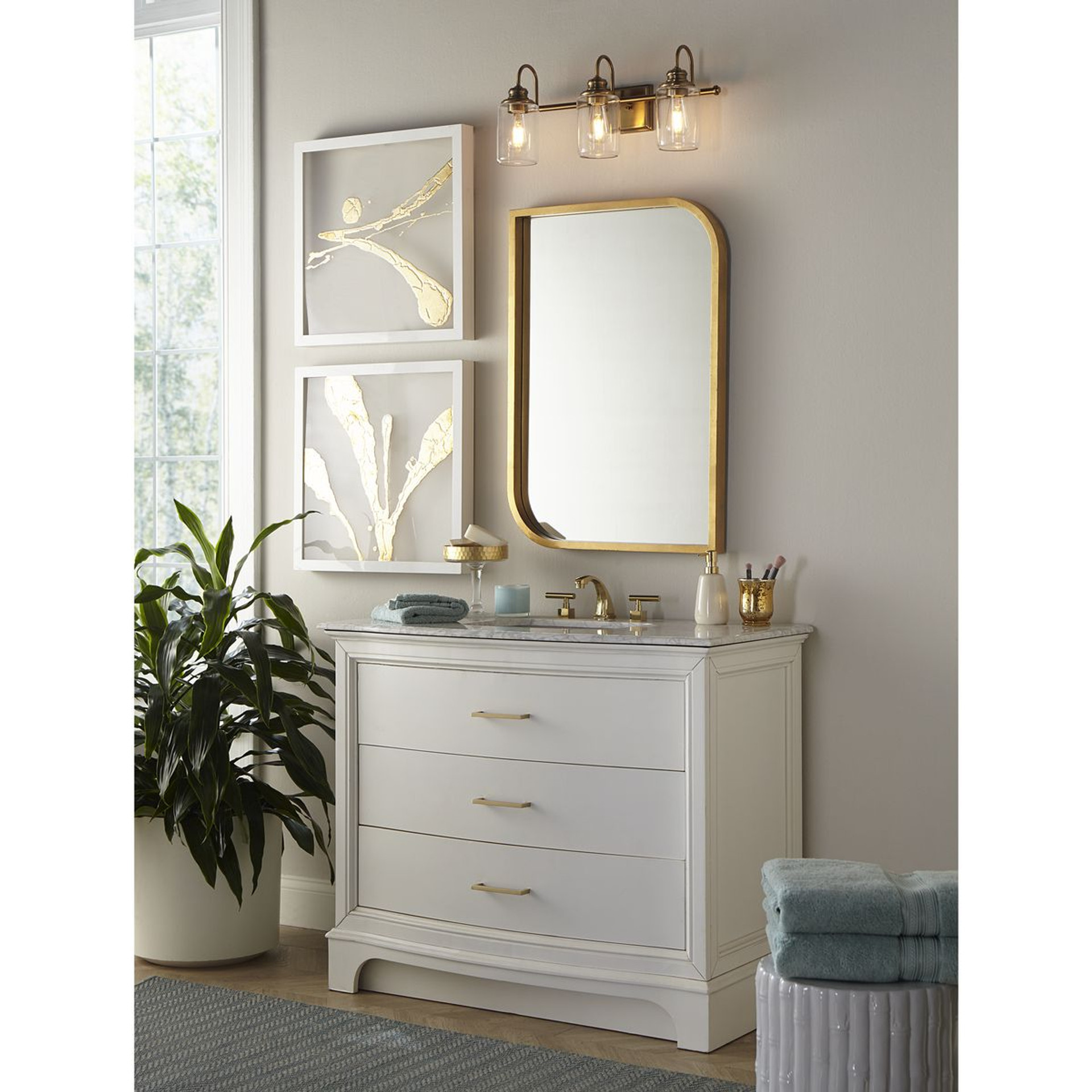 Progress Lighting Aiken Collection Three-Light Clear Glass Vintage Style Brass Farmhouse Style Bath Vanity Wall Light - Damp Location Listed Application Shot Model P300322-163