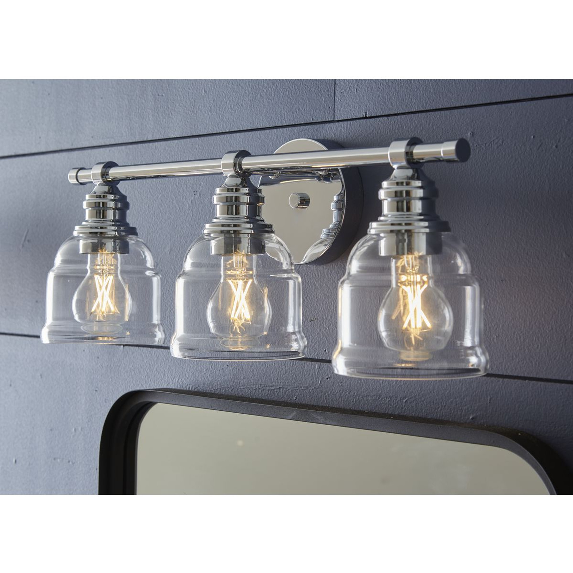 Progress Lighting Ambrose Collection Three-Light Farmhouse Polished Chrome Clear Glass Bath Vanity Light - Damp Location Listed Application Shot Model P300375-015