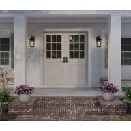 Progress Lighting Padgett Collection One-Light Transitional Antique Bronze Clear Seeded Glass Outdoor Wall Lantern - Wet Location Listed Application Shot Model P560308-020