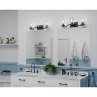Progress Lighting Lassiter Collection Three-Light Matte Black Clear Glass Modern Bath Vanity Light - Damp Location Listed Application Shot Model P300258-031