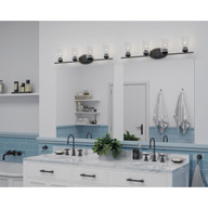 Progress Lighting Riley Collection Four-Light Matte Black Clear Glass Modern Bath Vanity Light - Damp Location Listed Application Shot Model P300279-031