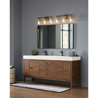 Progress Lighting Cassell Collection Three-Light Vintage Brass Matte Black Luxe Industrial Bath & Vanity Light - Damp Location Listed Application Shot Model P300482-163