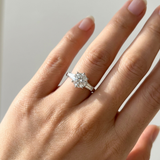 1.30tcw round-cut diamond engagement ring in three-stone setting — three-quarter angle (2)