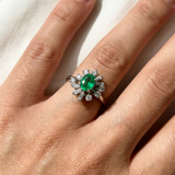 Art deco emerald ring with tapered baguette diamonds top-down view