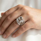 Champagne diamond ring worn on model's hand, showing light reflection on 1.92 ct center diamond