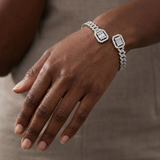 Bypass open bangle 14kt white gold with baguette and round stone halo close-up