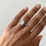 1.70tcw oval-cut sapphire engagement ring in three-stone setting — on-hand modeled view (2)