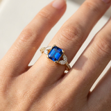 Emerald cut sapphire ring 1.18ct blue sapphire diamond accents 14kt yellow gold worn by model