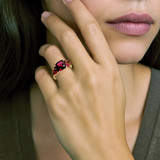 Garnet ring worn on model hand showing sparkle Garnet ring worn on model hand showing sparkle