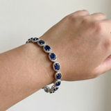 Oval natural sapphire with diamond halo accents 14kt white gold close-up