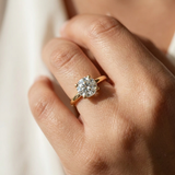 0.93tcw round-cut diamond engagement ring in solitaire setting in yellow gold — three-quarter angle (2)