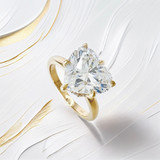 macro detail of heart shaped 3 carat lab diamond engagement ring with hidden halo and claw prongs in 14kt yellow gold Astoria New York jewelry store