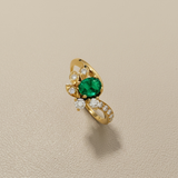 0.30ct oval emerald with 0.20ct diamond accents 18kt yellow gold side view