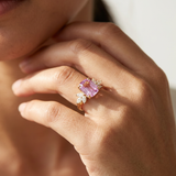 Pink sapphire engagement ring worn on finger, 3 carat cushion cut Sri Lanka sapphire