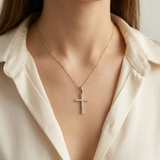 Small natural diamond cross 14kt white gold close-up