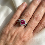 Princess cut ruby diamond cocktail ring invisible setting white gold model worn on hand