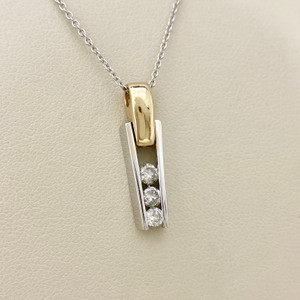 Treasured & Co. delicate diamond necklace with 0.13 total carat weight, set in a modern two-tone gold pendant.