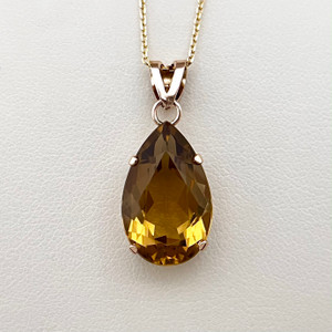 Treasured & Co. statement necklace with an 11.26tcw pear lemon topaz pendant, crafted in elegant 14kt gold.