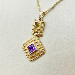Stunning amethyst and citrine pendant necklace crafted in 14kt yellow gold, showcasing 0.49tcw gemstones for a bold yet elegant look Treasured & Co.
