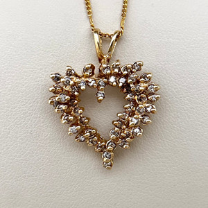 Earthly diamond heart pendant necklace featuring 0.79tcw diamonds, elegantly crafted in 14kt yellow gold Treasured & Co.