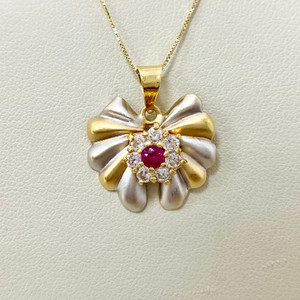Tourmaline ribbon pendant necklace featuring 0.93tcw gemstones, elegantly crafted in a two-tone gold ribbon design Treasured & Co.