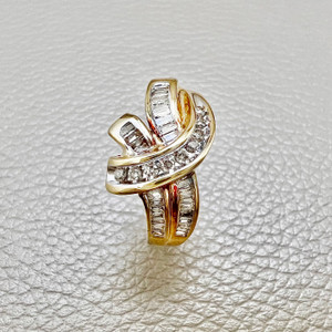 Grey tapered baguette diamond ring featuring 0.46tcw diamonds, crafted in unique 14kt yellow gold with a vintage design Treasured & Co.