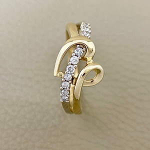 Diamond heart ring featuring 0.16tcw diamonds, crafted in 14kt yellow gold with a unique curved heart design for her Treasured & Co.