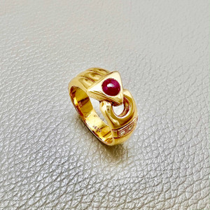 Vintage-inspired cabochon ruby ring with 0.52tcw, accented by zirconias, designed for women as a simple and unique statement piece Treasured & Co.