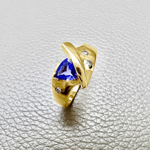 Trillion tanzanite ring featuring 0.41tcw, crafted in 14kt yellow gold, a unique design perfect for both men and women Treasured And Co.