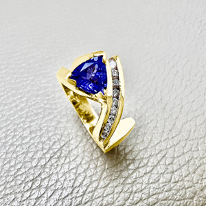Trillion tanzanite ring featuring 1.09tcw, crafted in 14kt yellow gold, a unique unisex statement ring perfect for both men and women Treasured & Co.