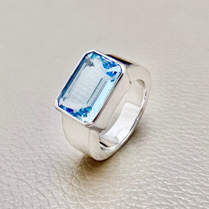 15.00tcw emerald-cut aquamarine ring in 14kt white gold, bezel set for a modern and bold design, perfect as a statement ring for men or women Treasured & Co.