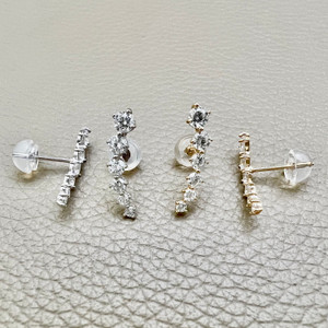 Classic graduating zirconia stud earrings 0.52tcw, made in 14kt white or yellow gold. A beautiful pair of stud earrings by Treasured & Co., Astoria.