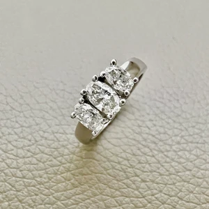 1.00tcw oval-cut diamond engagement ring in three-stone setting — front view