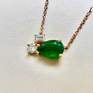 Timeless pear emerald and diamond necklace 1.89tcw, showcasing a pear-shaped emerald and diamonds, designed in 14kt yellow gold. A one of a kind necklace for women by Treasured & Co., Astoria, New York.