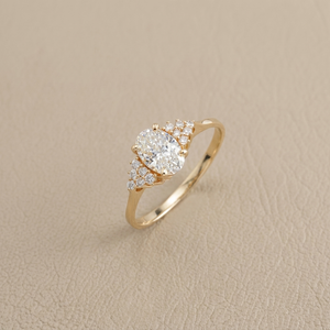 Dainty oval diamond ring with side stones 0.56tcw natural diamond 14kt yellow gold angle