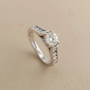 1.00tcw round-cut diamond engagement ring in channel-set setting — three-quarter angle