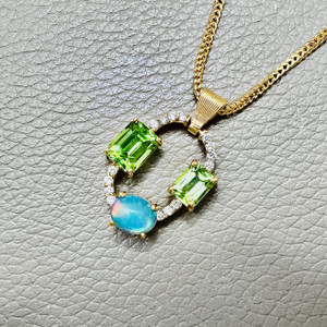 Opal And Peridot Necklace showcasing lab diamonds in 14kt yellow gold Opal And Peridot Necklace showcasing lab diamonds in 14kt yellow gold